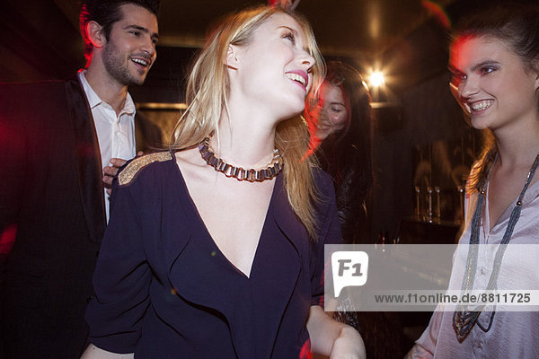 Young woman partying with friends