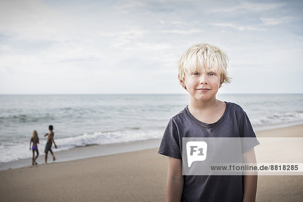 lächeln  Strand  Junge - Person