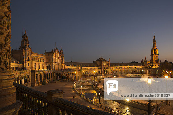 The illuminated Plaza de España at dusk  Seville  Seville province  Andalusia  Spain