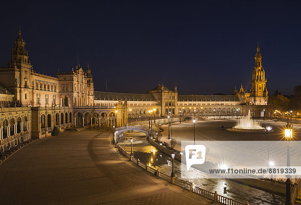 The illuminated Plaza de España at dusk Seville Seville province Andalusia Spain