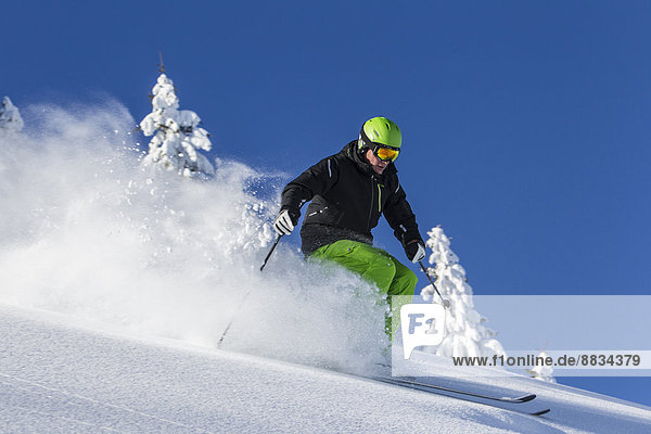 Germany  Bavaria  Sudelfeld  Skier in deep powder snow