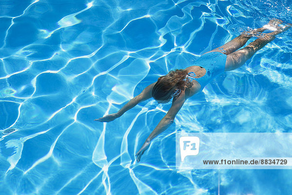 Italy  woman diving in swimmingpool