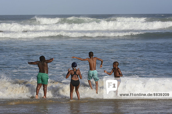 Children on the beach of East London  Eastern Cape  South Africa