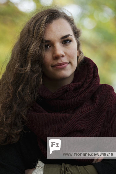 Portrait of confident young woman outdoors
