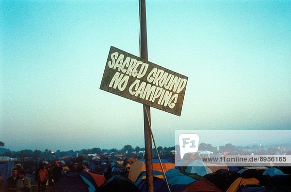 A sign ´Sacred Ground No Camping´ at the Glastonbury Festival  UK 1999.