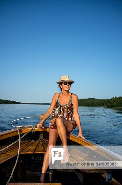 Mid adult woman on boat  Sweden