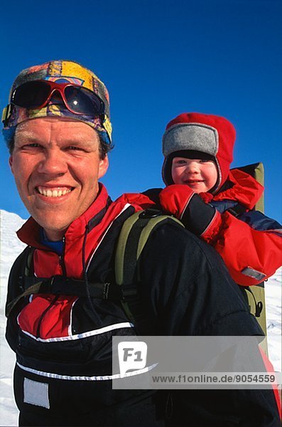 Smiling man with son on back  Dalarna  Sweden