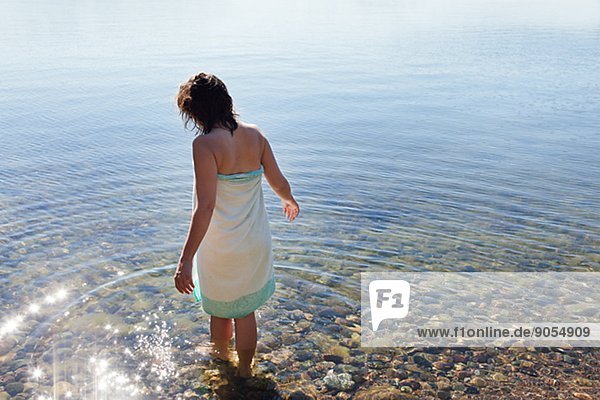 Woman wading in water  Sweden