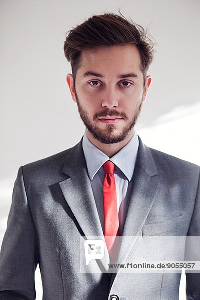 Portrait of young man wearing suit  London  United Kingdom