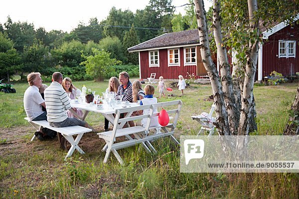 Family having meal in garden  oland  Sweden