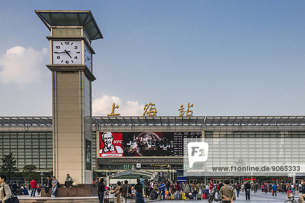Central Station with clock tower and people in front of the entrance  Shanghai  China