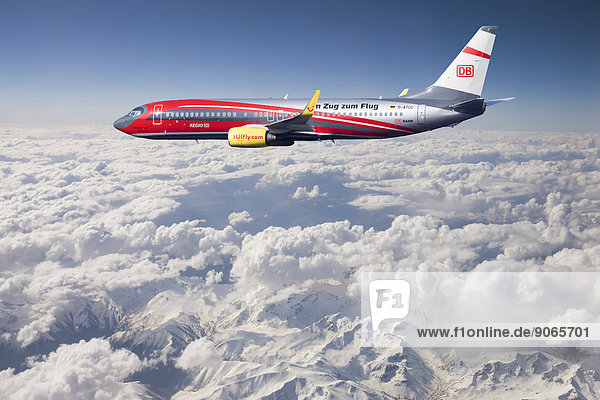 'TUIfly Boeing 737-8K5 WL with inscription ''Rail & Fly''  with the train to the airport  in flight over mountains  Turkey'