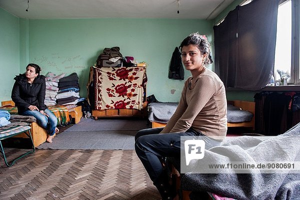 Sofia Bulgaria. Female Syrian refugee and her nice living in boredom and without privacy in refugee camp Vrajdebna.