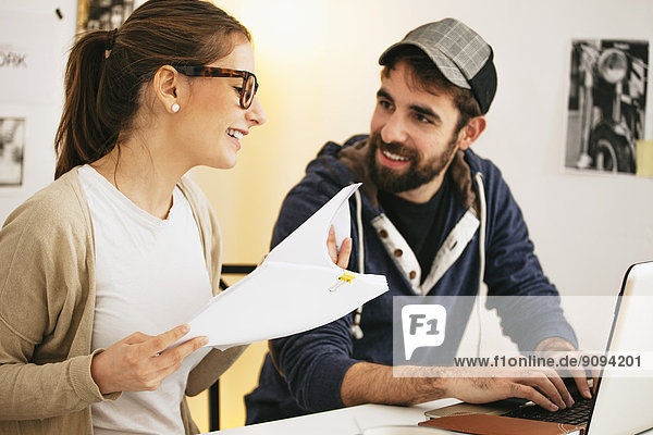 Young couple working together at modern home office