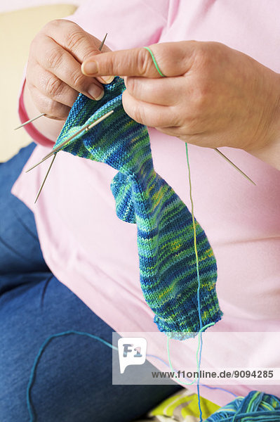 Germany  Mid-adult woman knitting socks