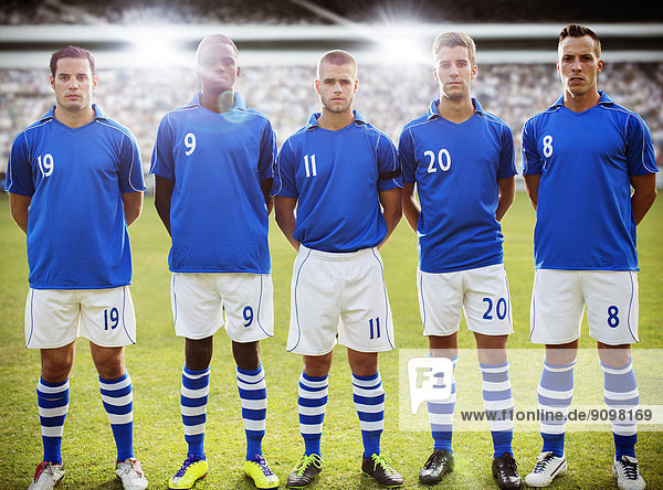 Soccer team standing on field