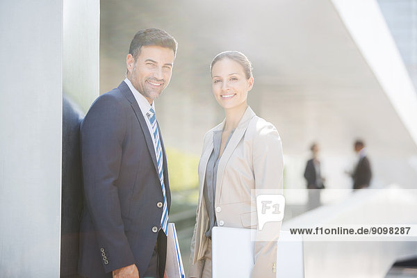 Portrait of confident business people outdoors