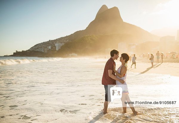 Young couple hugging at sunset  Ipanema Beach  Rio  Brazil