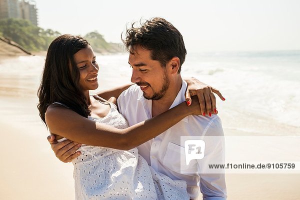 Romantic couple on Arpoador beach  Rio De Janeiro  Brazil