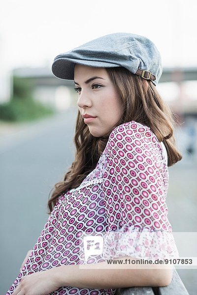 Young woman wearing flat cap