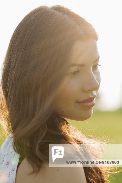 Young brunette woman in sunlight  portrait