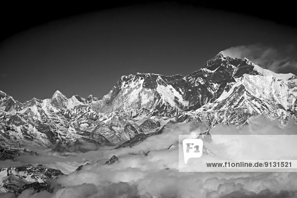 Mt Everest with its customary plume of cloud blowing off the summit  seen from 7000 meters Himalayan Mountains Nepal