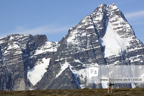 Backpacker in front of Mt Sir Donald  Selkirk Mountains  Glacier National Park  British Columbia  Canada