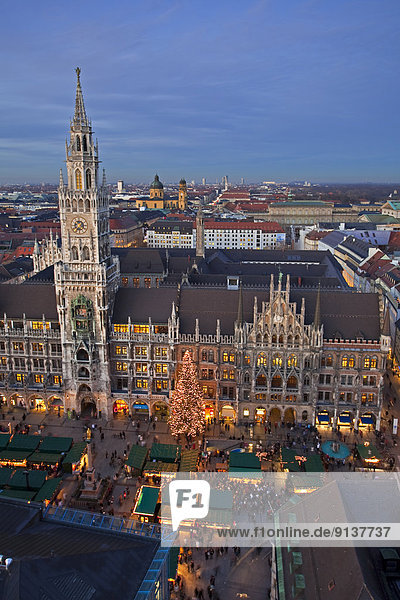 Aerial view of the Christkindlmarkt (Christmas Markets) in the Marienplatz outside the Neues Rathaus (New City Hall) at dusk in the City of München (Munich)  Bavaria  Germany  Europe.