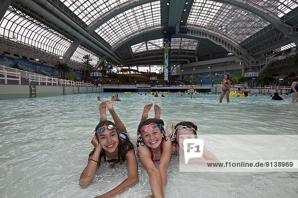 Three Young Girls Having A Great Time In The Waterpark At The West Edmonton Mall Edmonton Alberta Canada