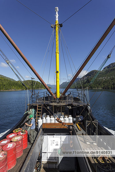 A crew member on the Uchuck 111 prepares barrels of fuel for delivery along the British Columbia coast of Canada.No Release