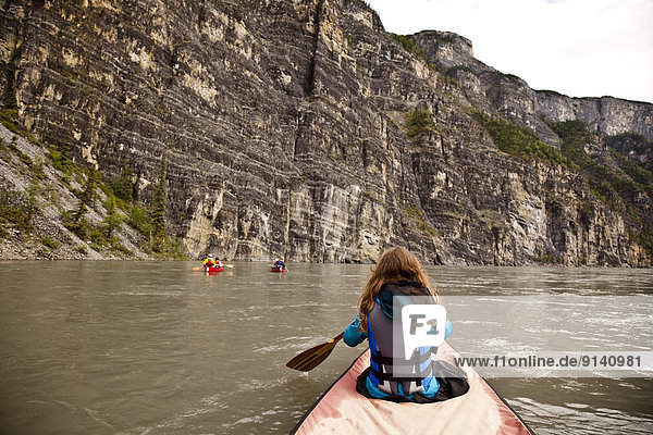 Three canoes in First Canyon on Nahanni River  Nahanni National Park Preserve  NWT  Canada.