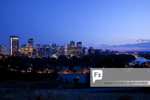 Calgary Skyline and Bow River at night view from north  Calgary  AB  Canada.