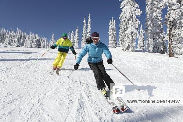 Female and male skier at Silver Star Mountain Resort  near Vernon  Okanagan  British Columbia  Canada
