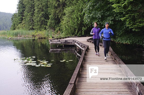 Running and hiking on the trail around Sasamat Lake  Belcarra Regional Park  Port Moody  British Columbia  Canada