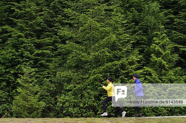 Running and hiking on the trail around Sasamat Lake  Belcarra Regional Park  Port Moody  British Columbia  Canada