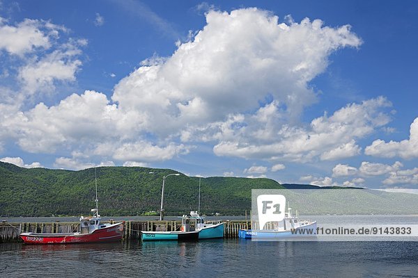 Boats and clouds in St. Anns Bay  near Englishmantown  Nova Scotia  Canada