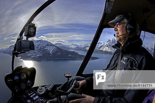 Helicopter pilot  Chilko Lake  Coast Mountains  British Columbia  Canada