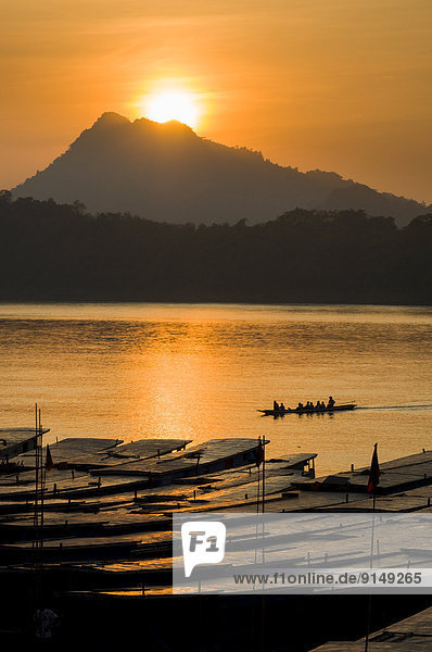 The sun sets over the Mekong River in Luang Probang  Laos