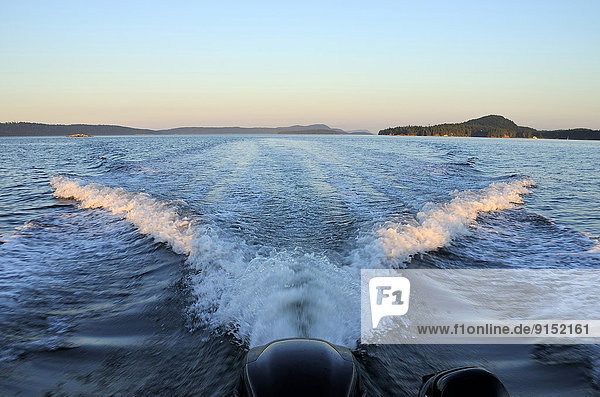 A v shaped wake from the boat makes an impressive scene in the waters of the Straight of Georgia near Vancouver Island British Columbia  Canada.