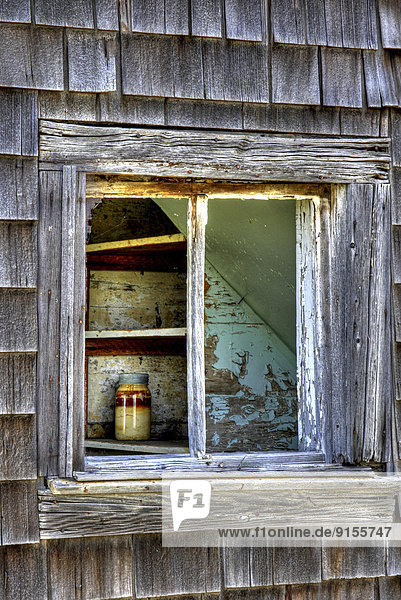 SK  Southern Saskatchewan  abandoned farm house  solitary mason jar  broken window  along Highway 4