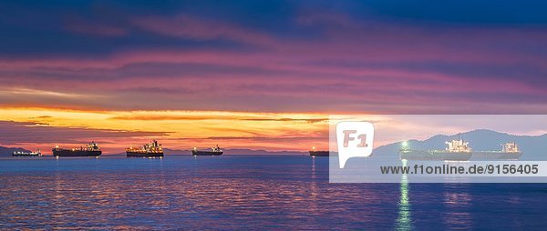 Freighters at sunset  Burrard Inlet  Vancouver  British Columbia  Canada