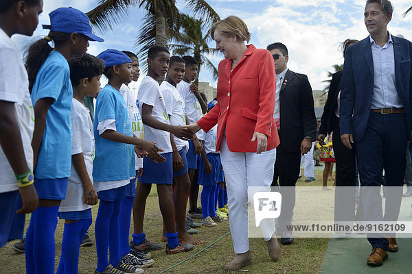 German Chancellor Angela Merkel visiting a social project for children and adolescents run by the German Society for International Cooperation  GIZ  during her visit of the FIFA World Cup 2014  Salvador also Salvador da Bahia  Bahia  Brazil
