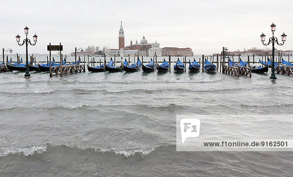 High water or acqua alta in St Mark's Square  Santa Maria Maggiore at the back  Venice  Veneto  Italy