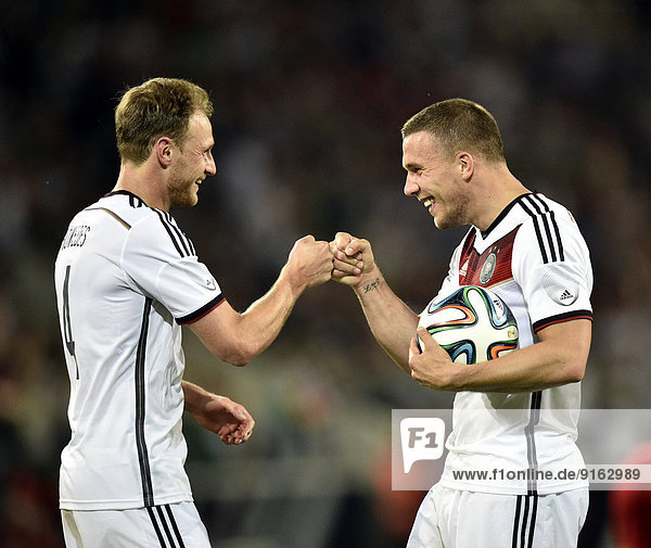 Celebrating a goal  Lukas Podolski  GER  right  and Benedikt Höwedes  GER  left  match Germany vs. Armenia  Coface Arena  Mainz  Rhineland-Palatinate  Germany