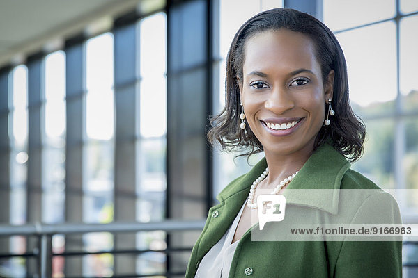 Black businesswoman smiling outdoors