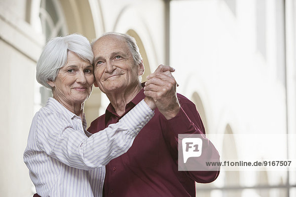 Senior Caucasian couple dancing
