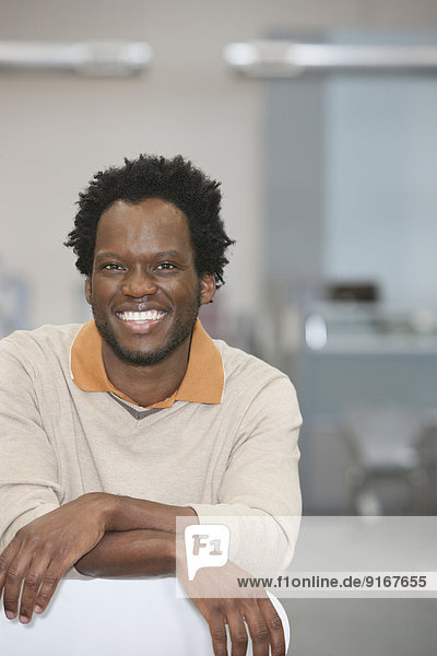 African American businessman smiling in office
