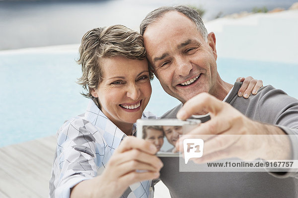 Couple taking picture together outdoors