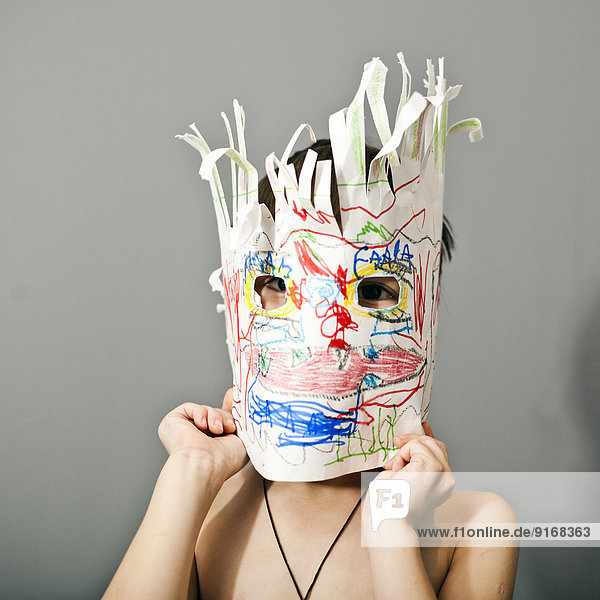 Boys wearing colorful mask