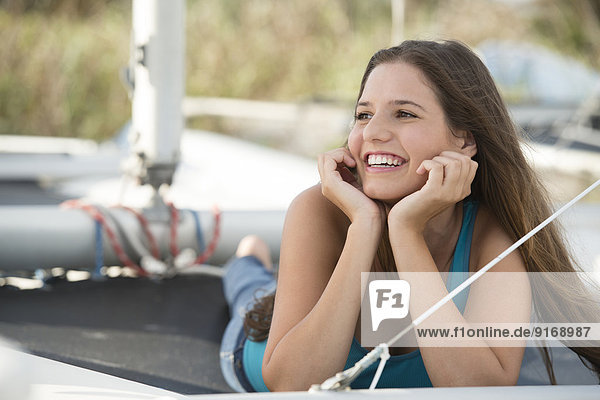 Caucasian woman laying outdoors